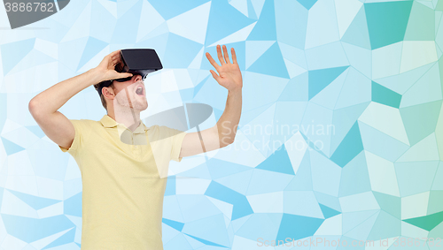 Image of young man in virtual reality headset or 3d glasses