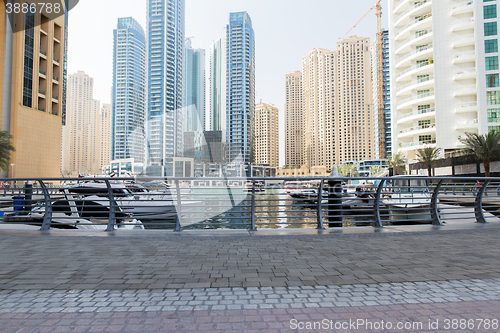 Image of Dubai city seafront or harbor with boats