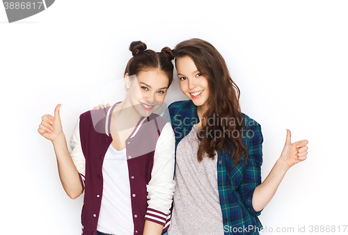 Image of happy smiling teenage girls showing thumbs up