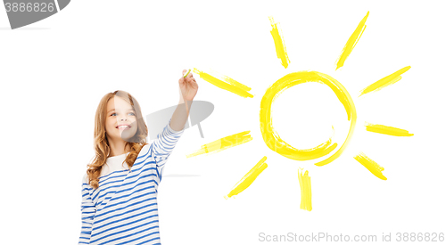 Image of girl drawing big sun in the air