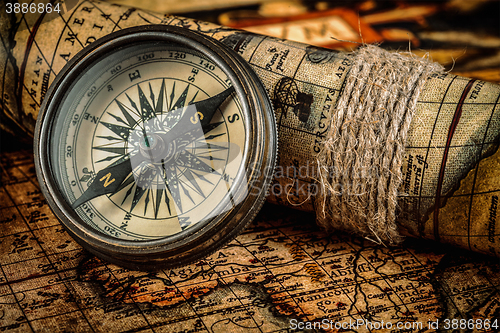 Image of Old vintage compass on ancient map
