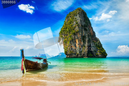 Image of Long tail boat on beach, Thailand