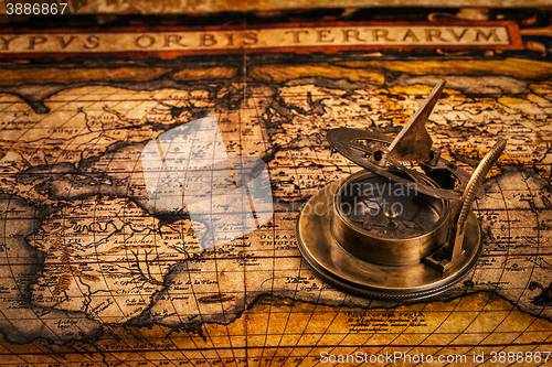 Image of Old vintage compass on ancient map