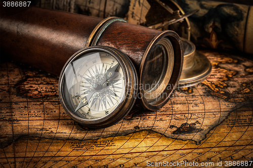 Image of Old vintage compass on ancient map