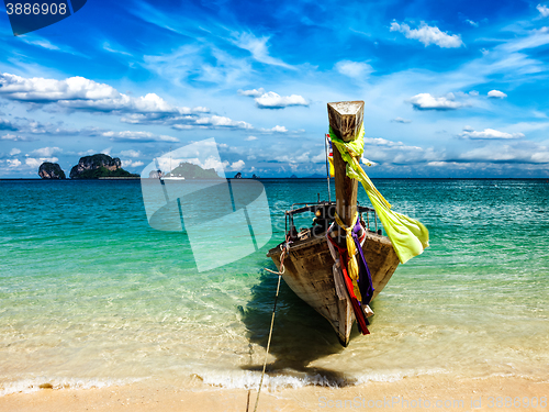 Image of Long tail boat on beach, Thailand