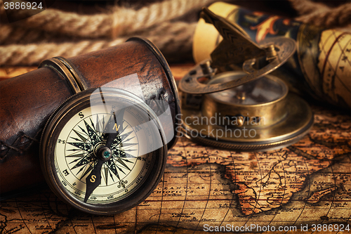 Image of Old vintage compass on ancient map