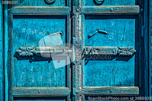 Image of Latch with padlock on door in India