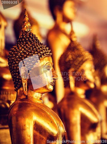 Image of Golden Buddha statues in buddhist temple