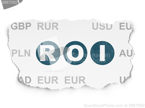 Image of Finance concept: ROI on Torn Paper background