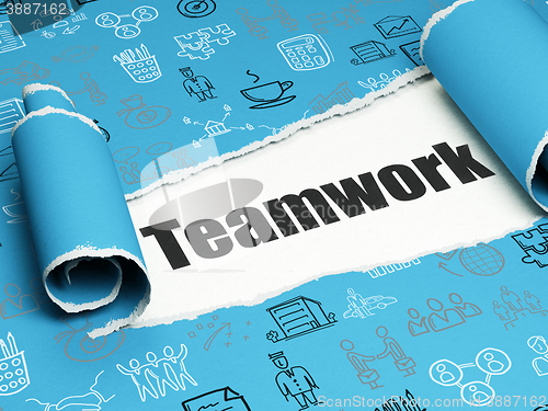 Image of Finance concept: black text Teamwork under the piece of  torn paper