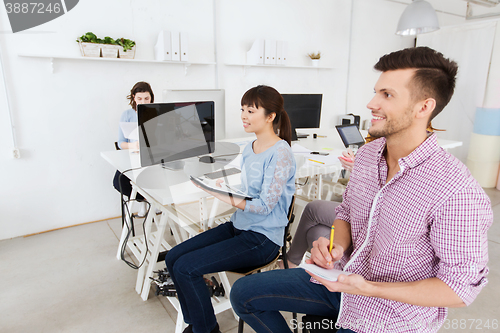 Image of creative team on conference or seminar at office