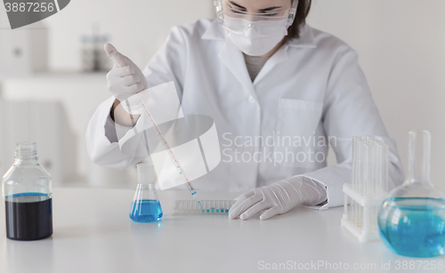 Image of close up of scientist making test in lab