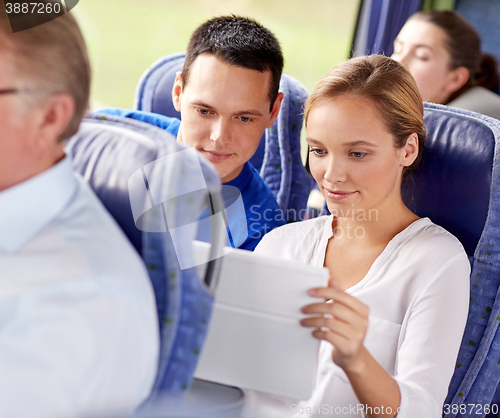 Image of happy couple with tablet pc in travel bus