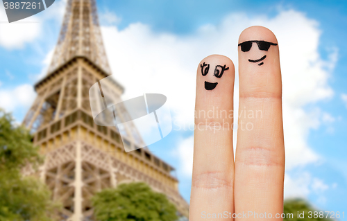 Image of close up of two fingers with smiley faces