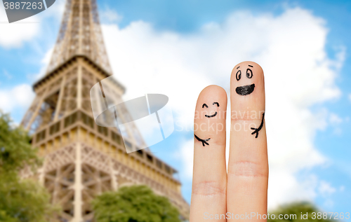 Image of close up of two fingers with smiley faces