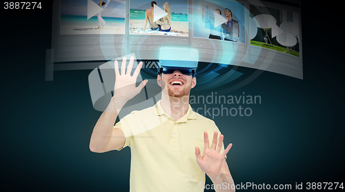 Image of happy man in virtual reality headset or 3d glasses