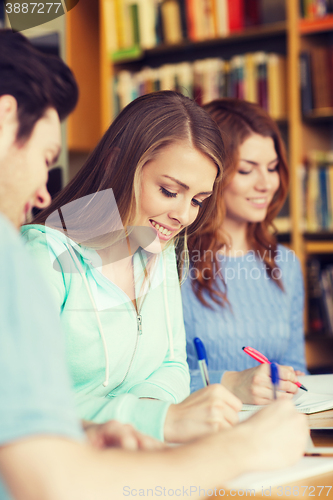 Image of students preparing to exam and writing in library