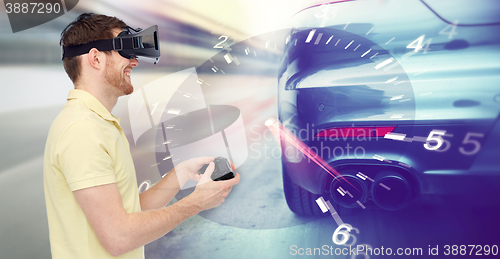 Image of man in virtual reality headset and car racing game