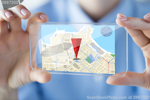 Image of close up of woman with transparent smartphone