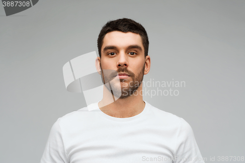 Image of young man portrait over gray background