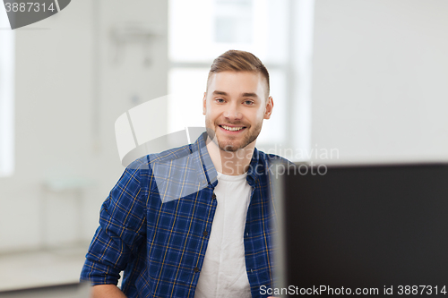 Image of happy creative man or student at office