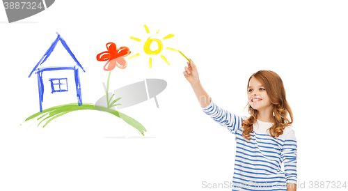 Image of girl drawing house in the air