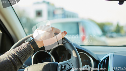 Image of Close-up Of A Man Hands Holding Steering Wheel While Driving Car