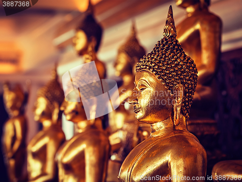 Image of Golden Buddha statues in buddhist temple