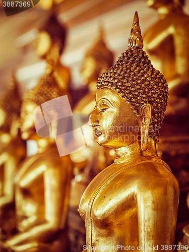 Image of Golden Buddha statues in buddhist temple