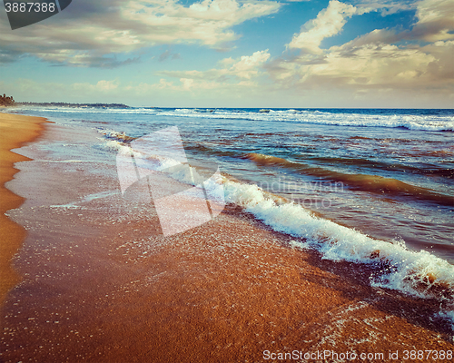 Image of Wave surging on sand