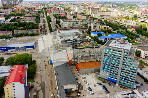 Image of Aerial view of office building and urban quarters