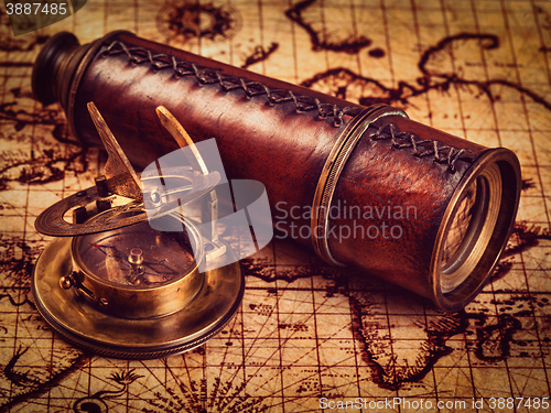 Image of Old vintage compass on ancient map