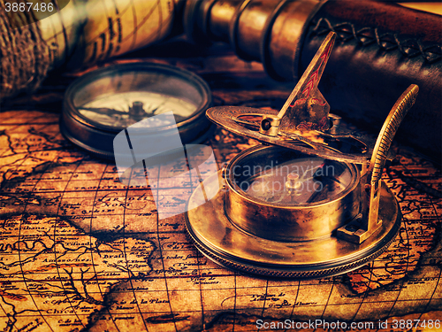 Image of Old vintage compass on ancient map