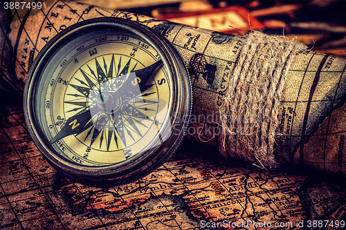 Image of Old vintage compass on ancient map