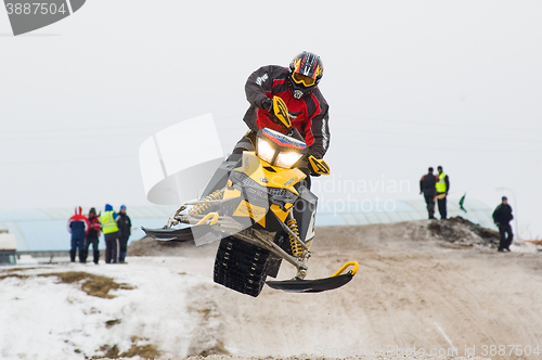 Image of Sportsman jump on snowmobile