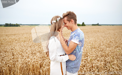 Image of happy smiling young hippie couple outdoors