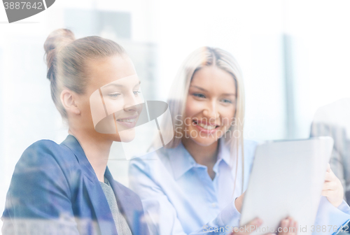 Image of business team with tablet pc having discussion