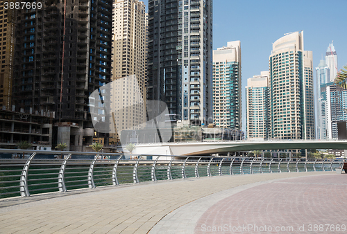 Image of Dubai city center with skyscrapers and bridge