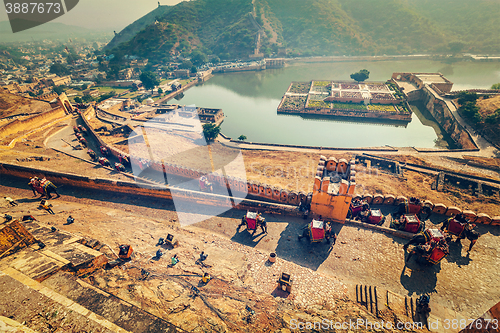 Image of Tourists riding elephants on ascend to Amer fort