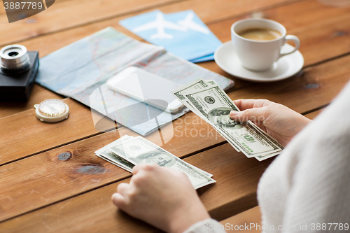 Image of close up of traveler hands counting dollar money