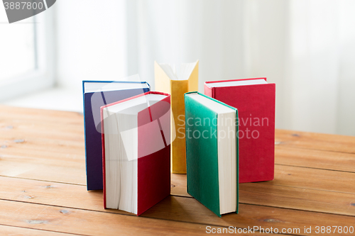 Image of close up of books on wooden table