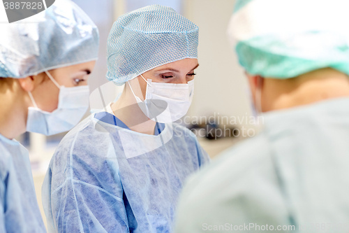 Image of group of surgeons in operating room at hospital