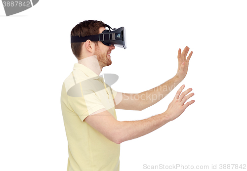 Image of happy man in virtual reality headset or 3d glasses