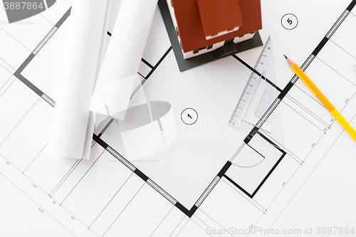 Image of close up of house model on architectural blueprint