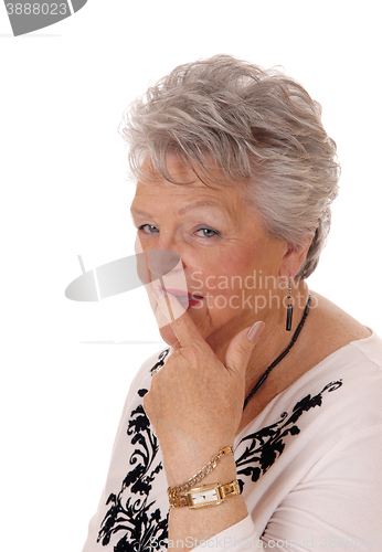 Image of Skeptical looking senior woman.