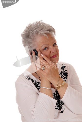 Image of Senior woman talking on her cell phone.