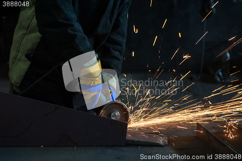 Image of worker welding metal 