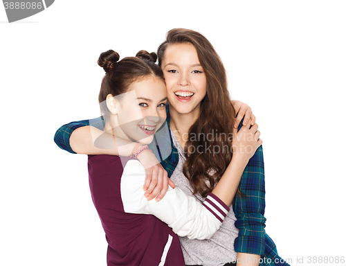 Image of happy smiling pretty teenage girls hugging