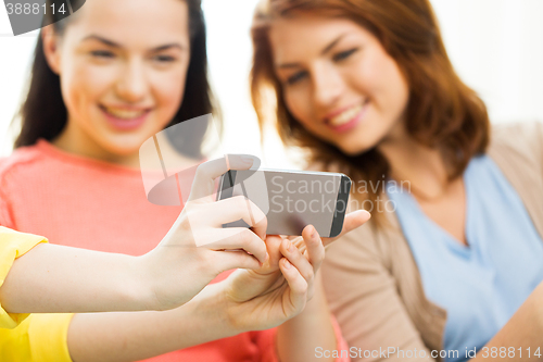 Image of close up of friends taking selfie with smartphone