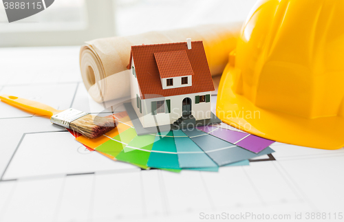 Image of close up of house blueprint with building tools